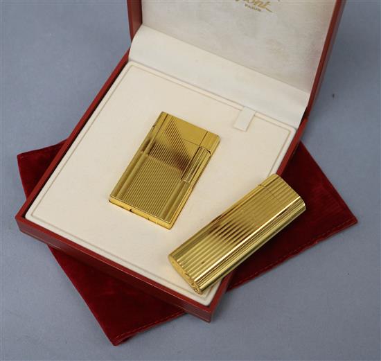 A Cartier lighter and a Dupont lighter